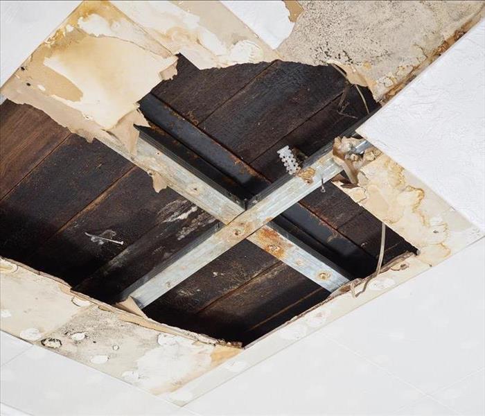 Hole on a ceiling, ceiling damaged by water