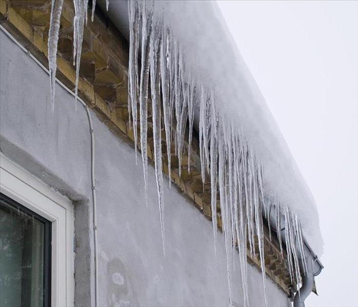 Icicles on a roof winter.