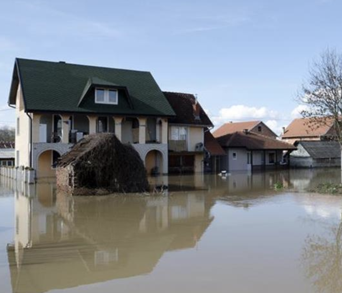 A home surrounded by flooded waters