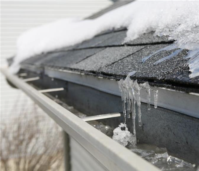 Ice and water on gutters of roof