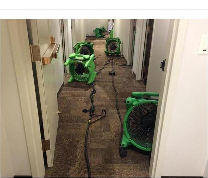 Drying equipment placed on wet carpet